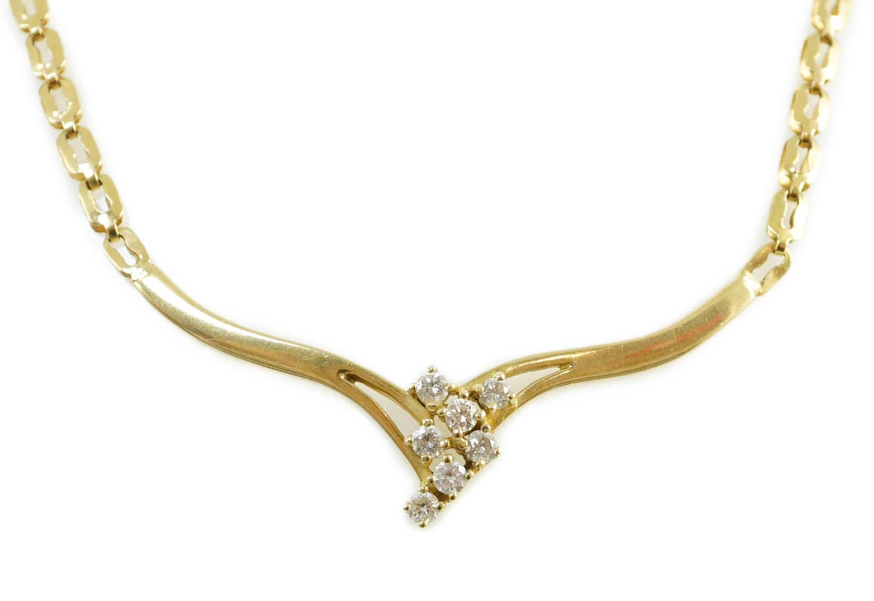 A modern 18k gold and seven stone diamond cluster set necklace